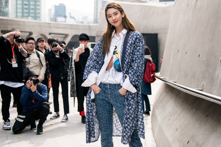 A trend-conscious fashionista making a statement at Seoul Fashion Week.
