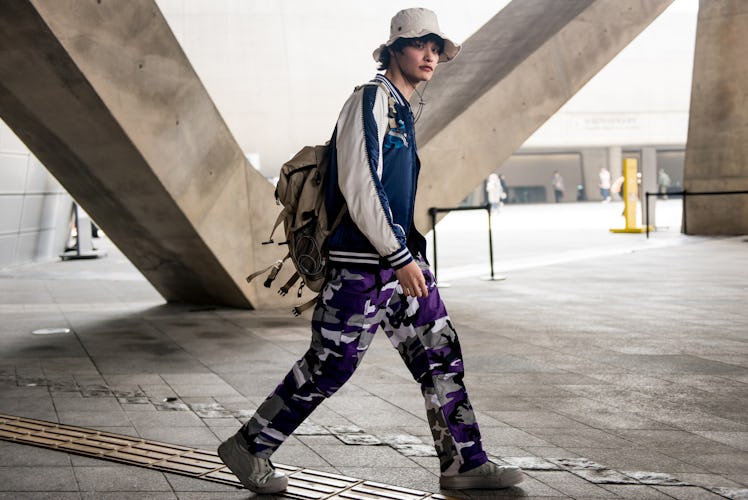 A boy showcasing his individual street style at Seoul Fashion Week.