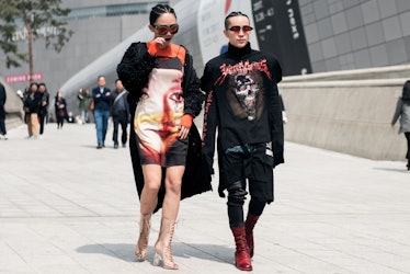 Stylish individuals flaunting their outfits on the streets of Seoul.
