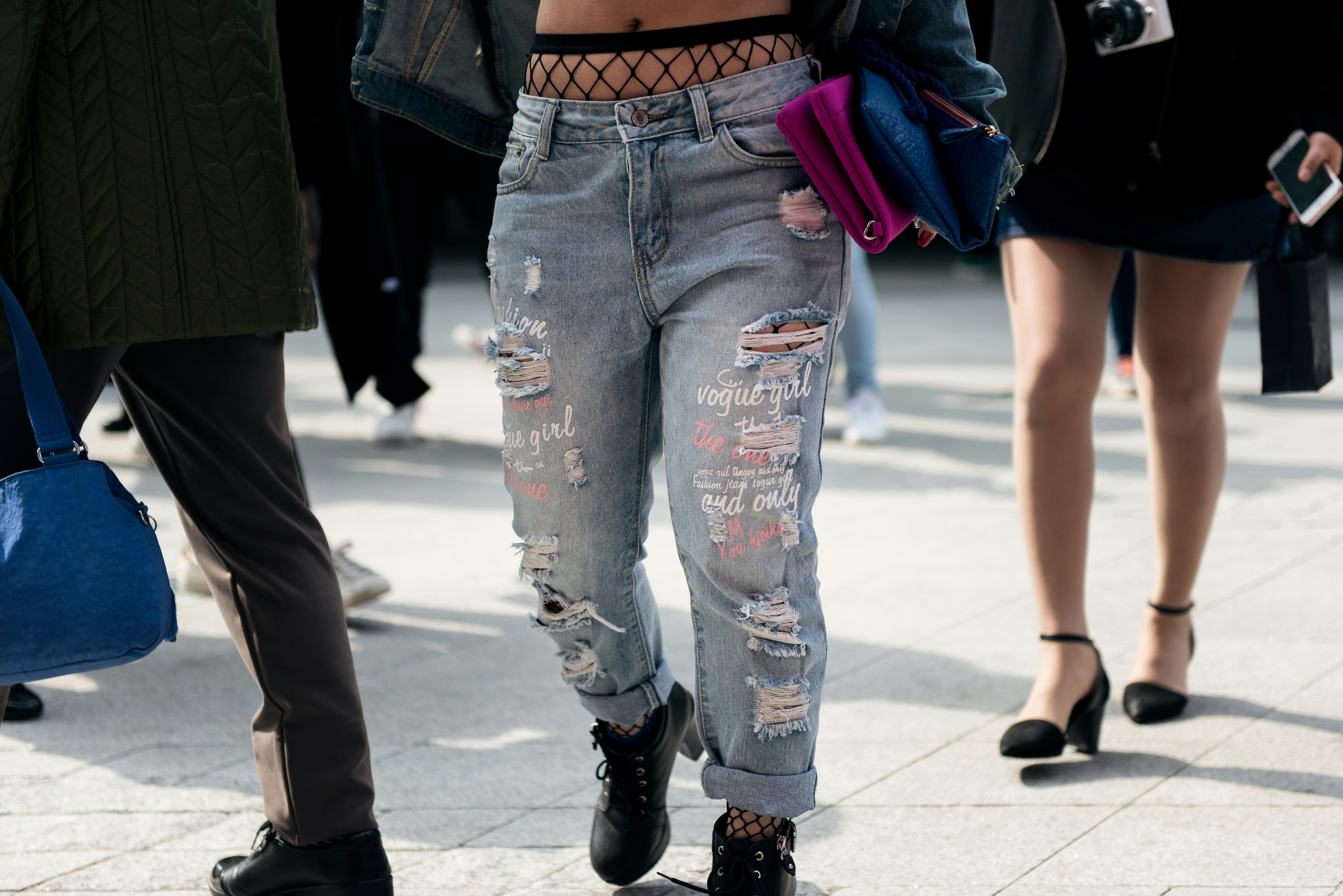 Why I'm Digging the Ripped Jeans with Fishnets Trend - House of