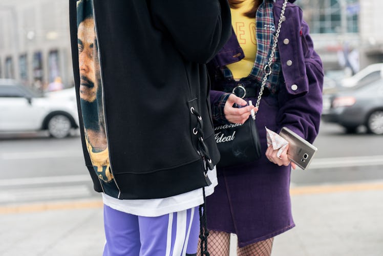 Two South Korea’s street style stars standing outside