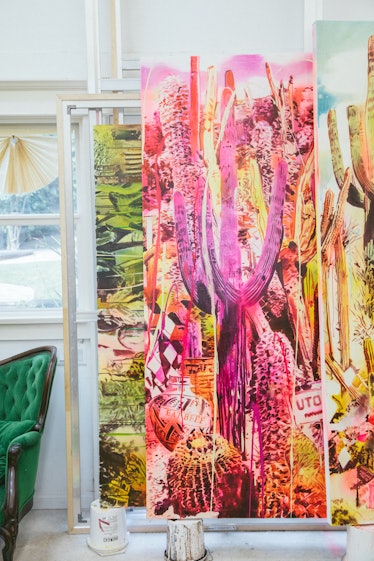 The inside of Rosson Crow studio with a large painting of pink cactus plants