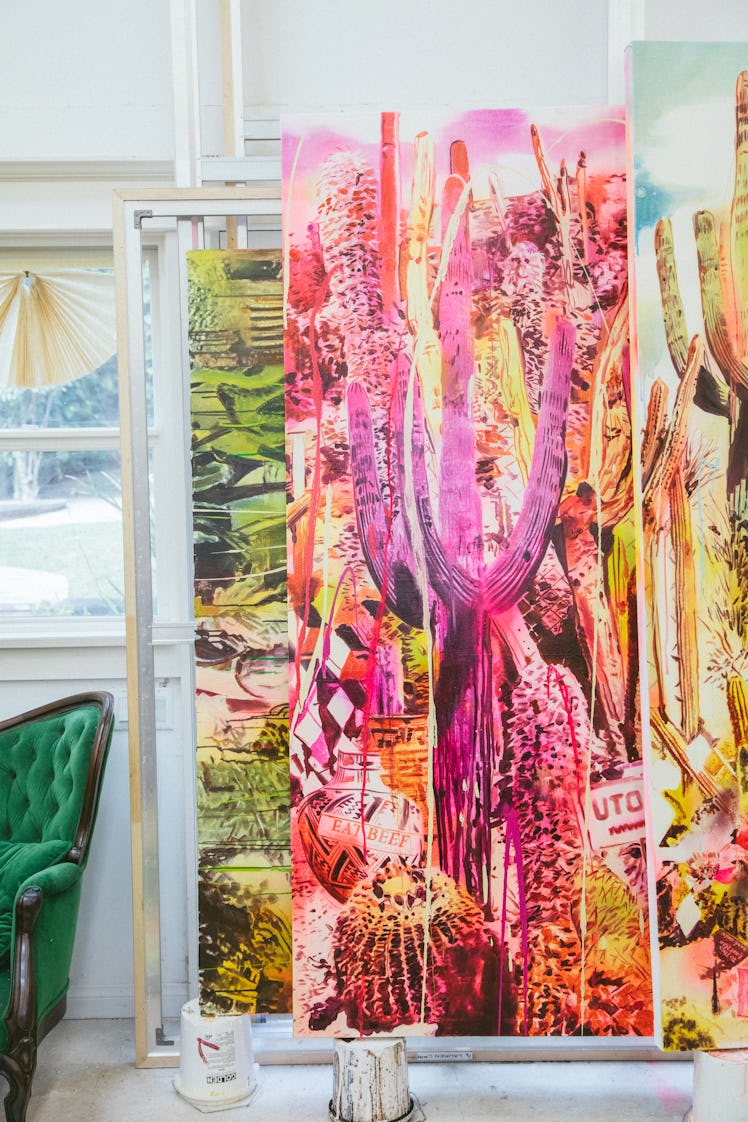 The inside of Rosson Crow studio with a large painting of pink cactus plants