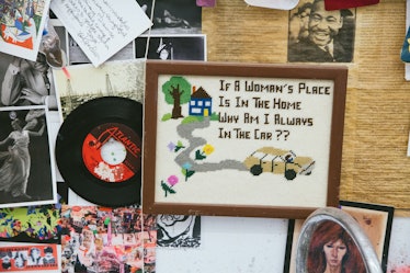 Embroidered image 'If a woman's place is in the home why am I always in the cart?' and stickers on a...