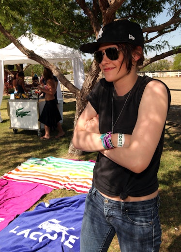 Kristen Stewart wearing sunglasses and a hat at Coachella