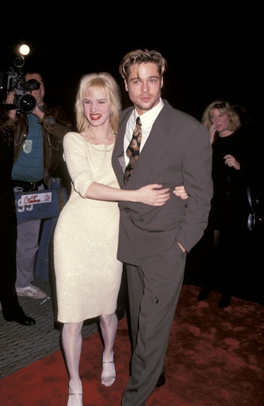 Brad Pitt and Juliette Lewis hugging on the red carpet