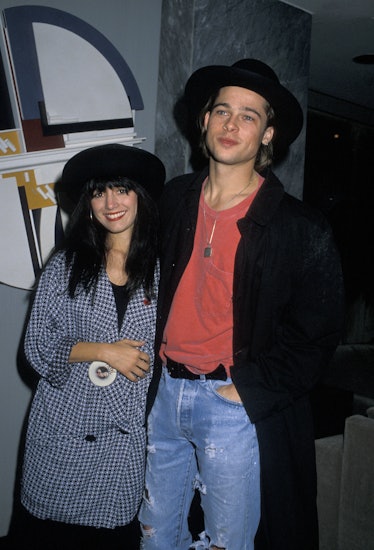 Brad Pitt giving a side hug and smiling along with Jill Schoelen