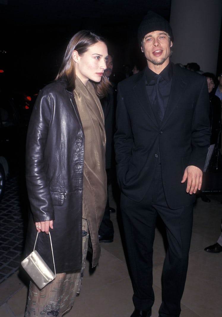 Brad Pitt standing and smiling next to Claire Forlani 