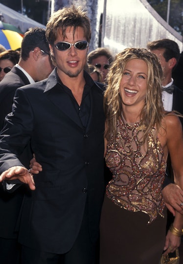 Brad Pitt and Jennifer Aniston hugging and smiling