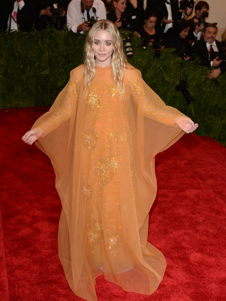 Ashley Olsen wearing an orange vintage Christian Dior gown