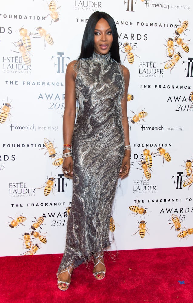 Naomi Campbell posing in a silver vintage gown at the 2015 Fragrance Foundation Awards red carpet