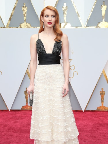 Emma Roberts posing in a black and white vintage Armani gown at the 89th Annual Academy Awards