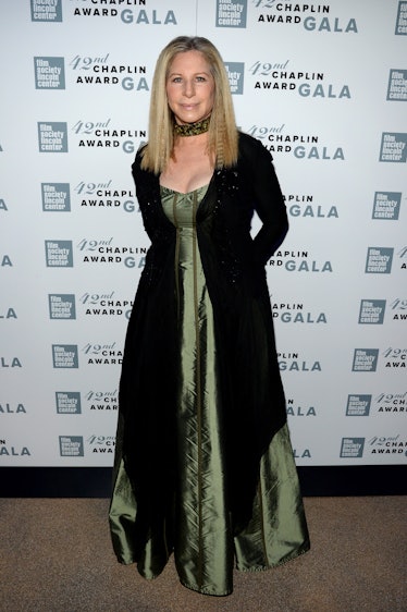 Barbra Streisand in an olive gown and black cape at the Chaplin Award Gala in 2015
