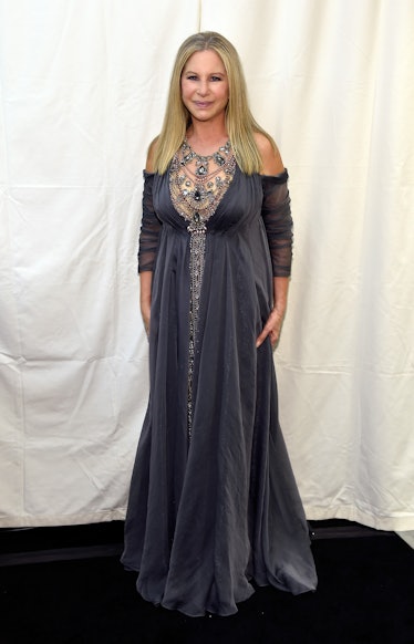 Barbra Streisand in a grey gown with beaded neck part at a red carpet event