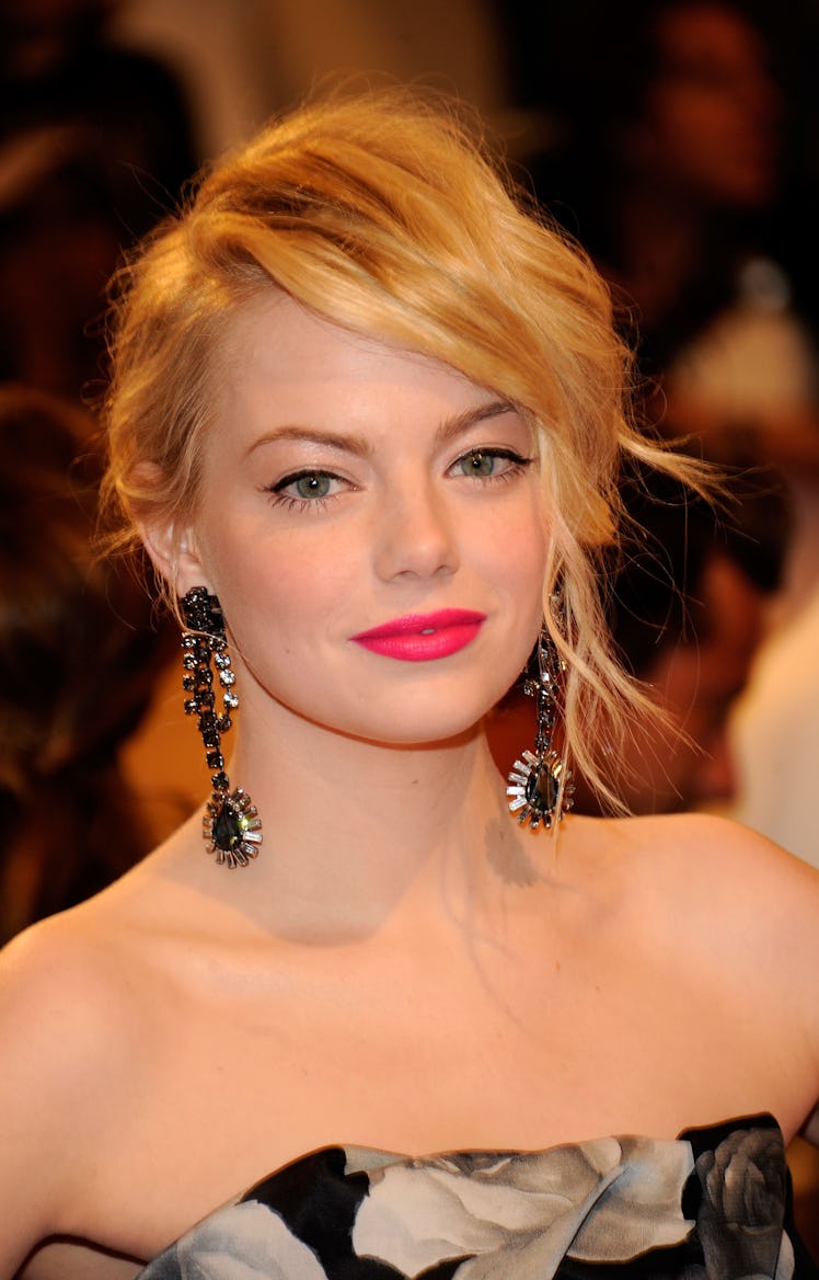 Emma Stone wearing hot pink lipstick at the Met Gala