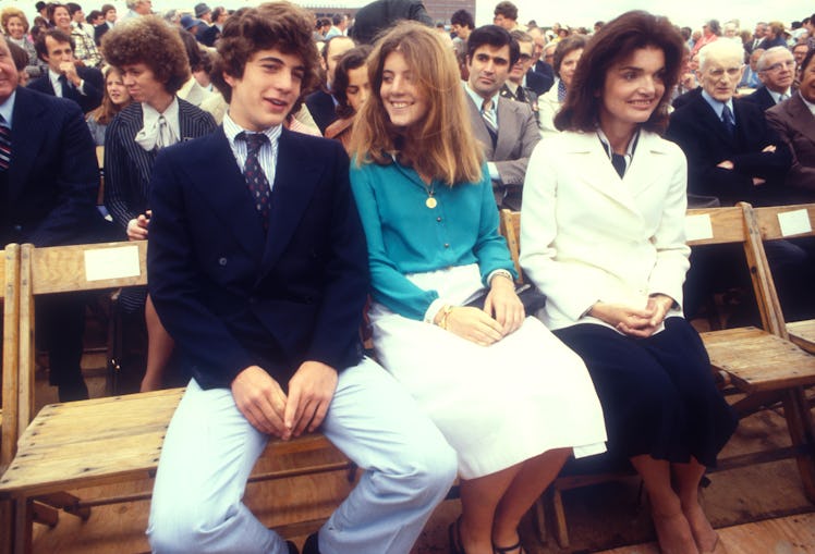  John F. Kennedy Jr., his sister Caroline, and their mother, Jacqueline at an event in the late 1970...
