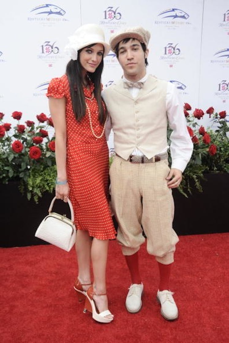 Ashlee Simpson in a red dress and Pete Wentz in a beige suit at the Kentucky Derby in 2010.