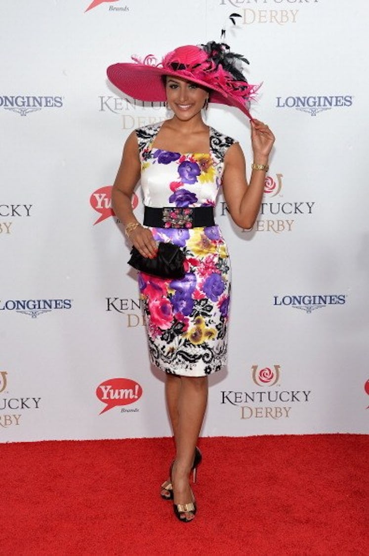 Nina Davuluri in a floral dress and hat at the Kentucky Derby in 2014.