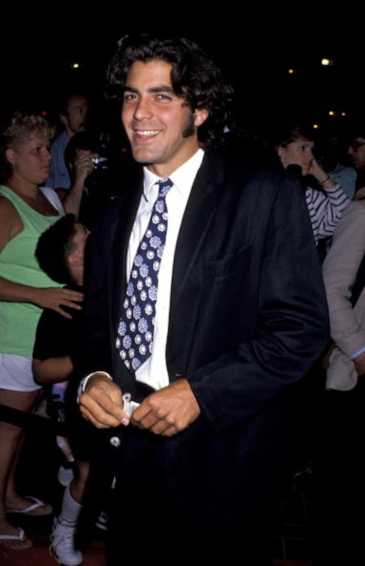 George Clooney in a multicolored tie with long hair