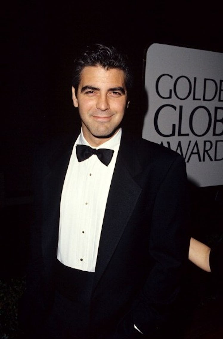 George in a black tux with black hair