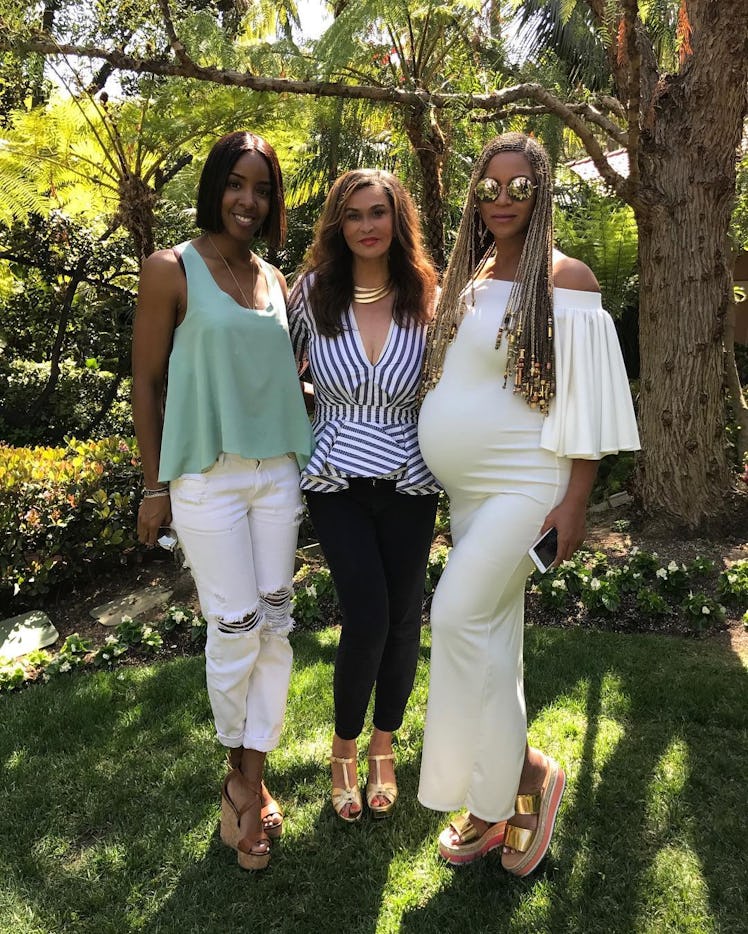 Tina Lawson, one of the savviest celebrity moms on social media, posing with Beyonce and Kelly Rowla...