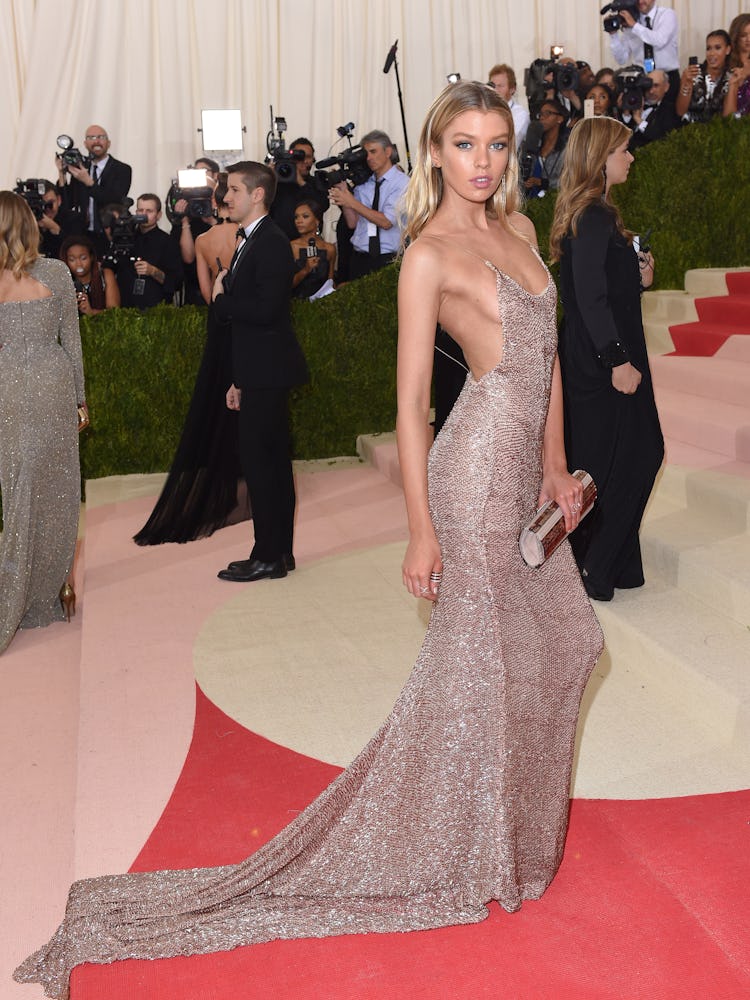 Stella Maxwell wearing a sparkly evening gown at the opening of “Manus x Machina: Fashion In An Age ...