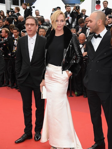 Uma Thurman in a black-white dress and jacket at the premiere of Ismael’s Ghosts opening the Cannes ...