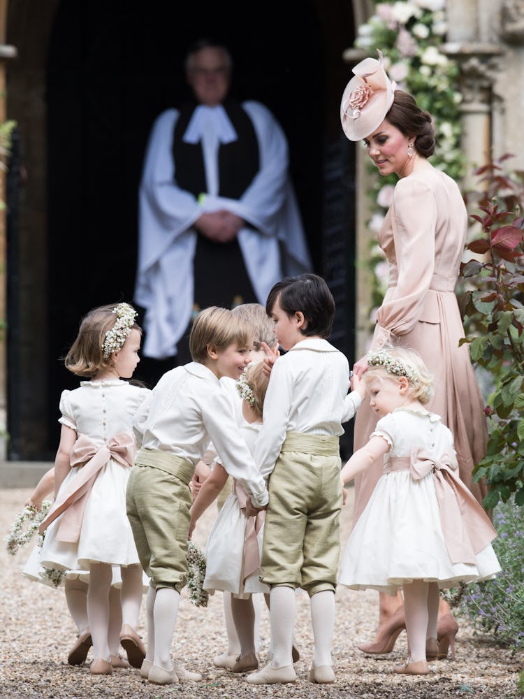 Kate Middleton, with a group of children at her sister's wedding ceremony in Englefield