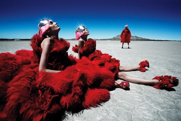 Three models dressed in puffy red dresses posing on Argentinean salt flats