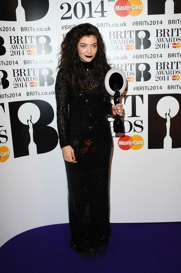 Lorde, winner of the International Female Solo Artist award, poses in the winners room at The BRIT A...