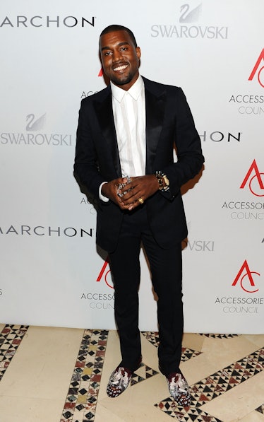 Kanye West in a black suit and a white shirt at the 14th Annual ACE Awards in 2010