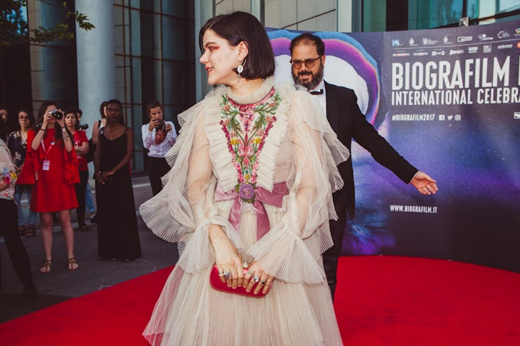 Soko wearing a Gucci white tulle dress at the red carpet for the premiere of her film La Danseuse