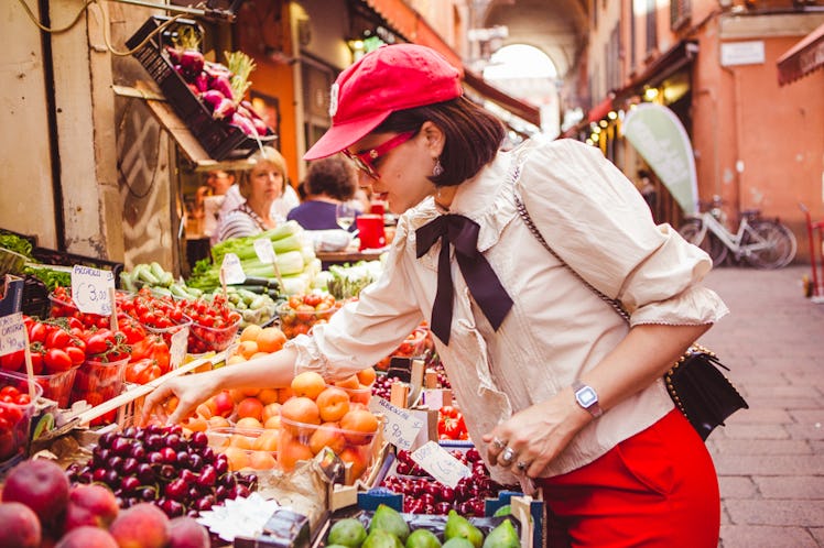 Soko buying fruits in the streets of Bologna