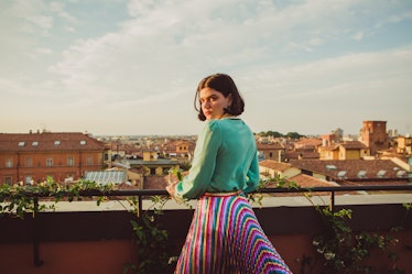 Soko posing on a private terrace overlooking Bologna