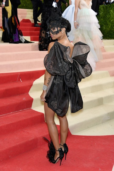 Zoe Kravitz in a black lacey mask and a black bow dress at the Met Gala