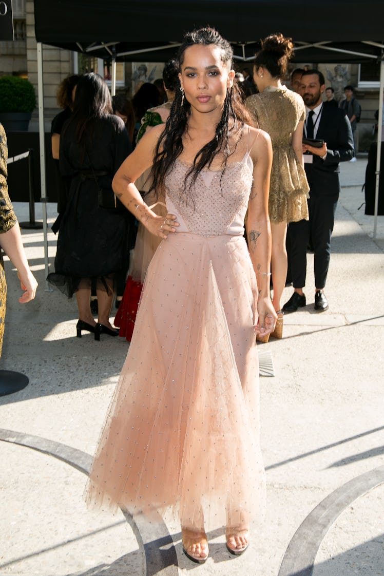 Zoe Kravitz on the sidewalk of the Valentino show in a light pink gown 