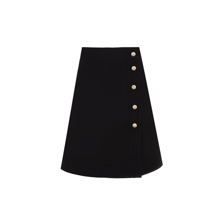 A black Gucci embellished mini skirt
