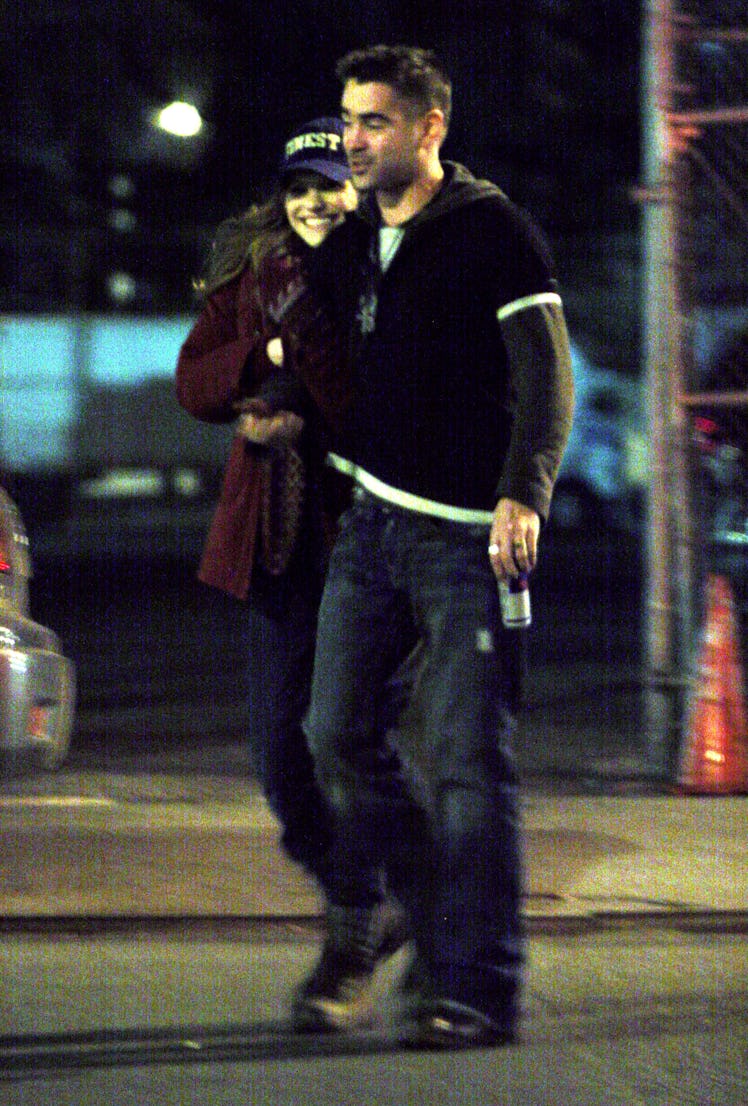 Colin Farrell with a red bull out on the streets. 