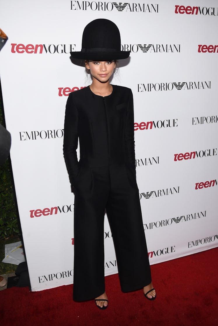 Zendaya wearing a big black hat 