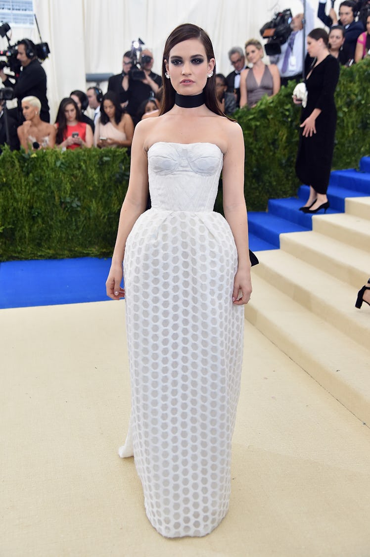 Lily James attends the "Rei Kawakubo/Comme des Garcons: Art Of The In-Between" Costume Institute Gal...