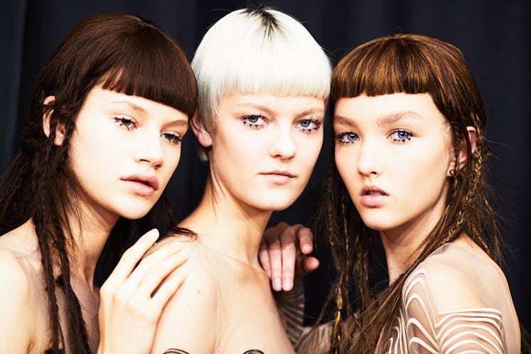 A close-up of three models at Iris Van Herpen's 10th Anniversary Fashion Show