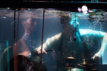 Between Music perfroming in a water box at Iris Van Herpen's 10th Anniversary Fashion Show