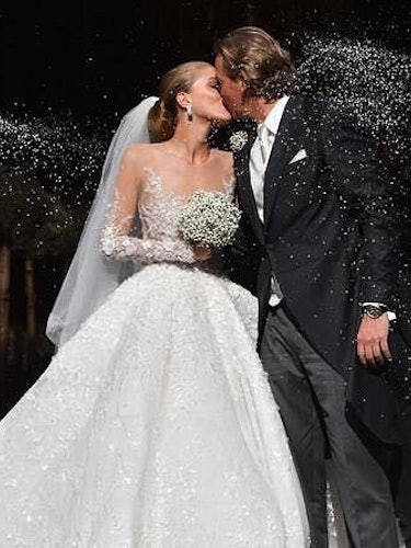 Victoria Swarovski wearing a dress designed by designer Michael Cinco at her wedding with Werner Mür...