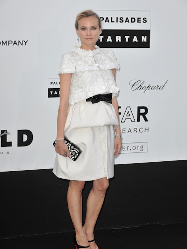 Diane Kruger in a white lace dress with a black belt at the 62nd Cannes Film Festival