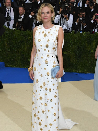 Diane Kruger in a white dress with golden beads at the “Rei Kawakubo/Comme des Garcons: Art Of The I...