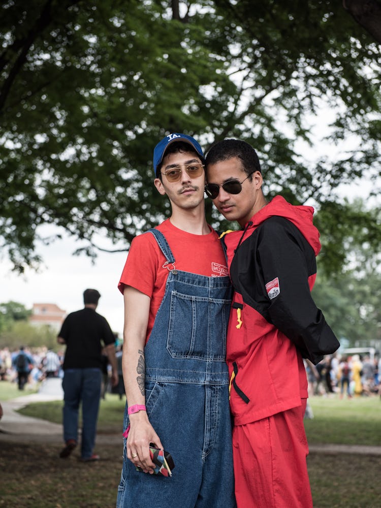 A man in a red shirt and blue dungarees and a man in a red-black tracksuit at the Pitchfork Music Fe...