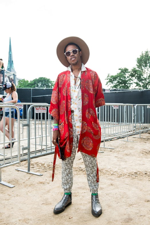 A man in a white floral jumpsuit and red kimono attending the Pitchfork Music Festival