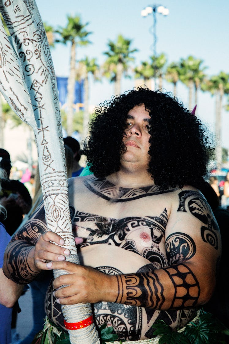 A man wearing the Maui from Moana costume at the 2017 Comic-Con International, held in San Diego