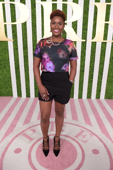 Issa Rae in floral top and black shorts