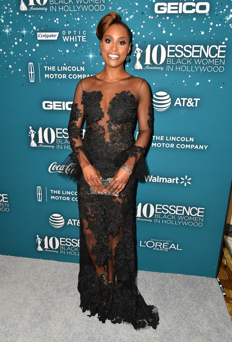 Issa Rae in a long semi see through black floral gown at the Essence Black Women event in Hollywood 